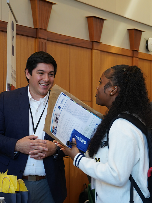 Students, employers, and staff interacting at the Michigan Public Health Career Fair