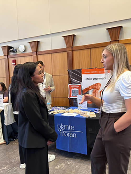 Students, employers, and staff interacting at the Michigan Public Health Career Fair