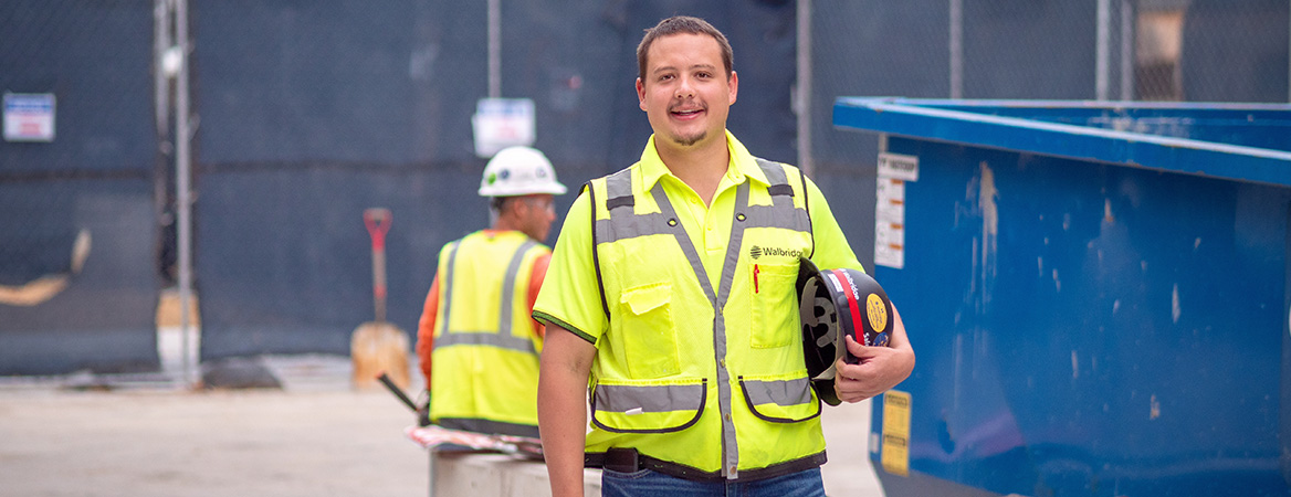 Clayton DesJardin posting in safety gear during his internship