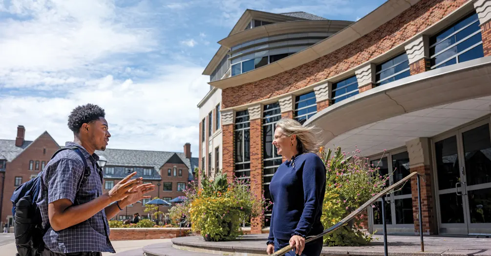 Undergraduate student Robert Lee, left, talks with Emily Youatt outside of the School of Public Health building.
