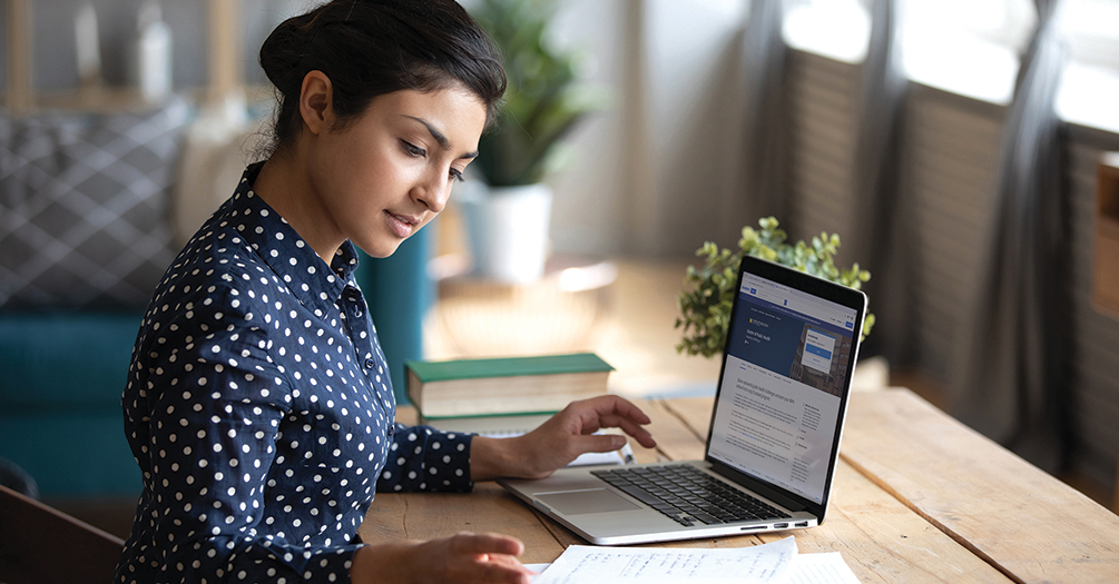 Student on laptop engaged in online learning