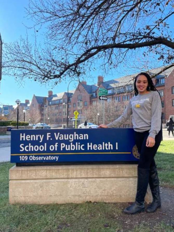 Kamara Gardner in front of the SPH sign