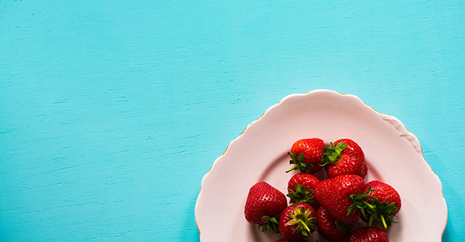 Strawberries on a white plate.