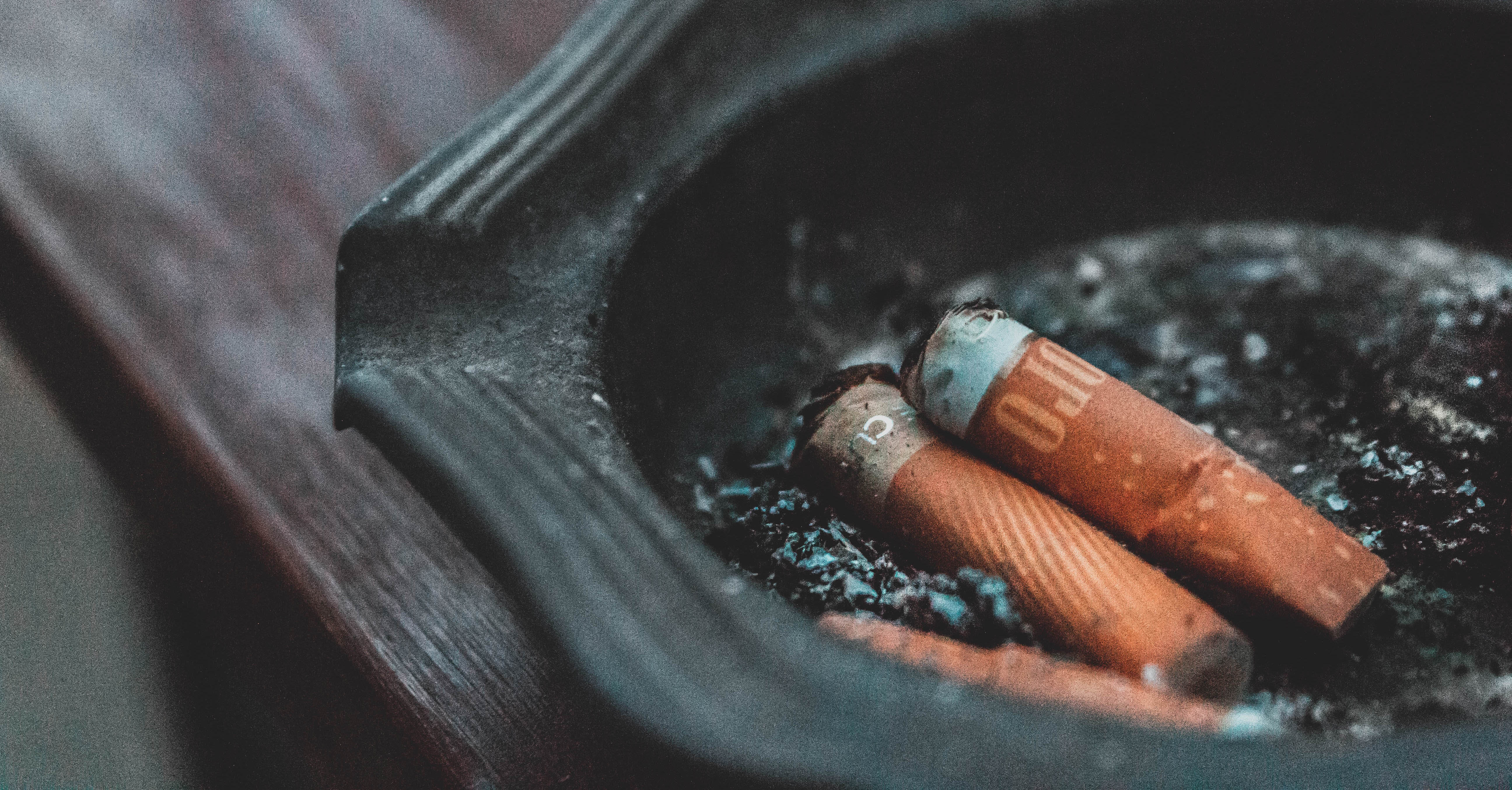 Used cigarettes in a tray.