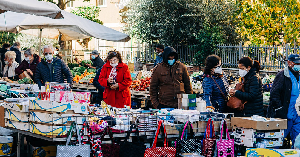 people at an outside market in the winter