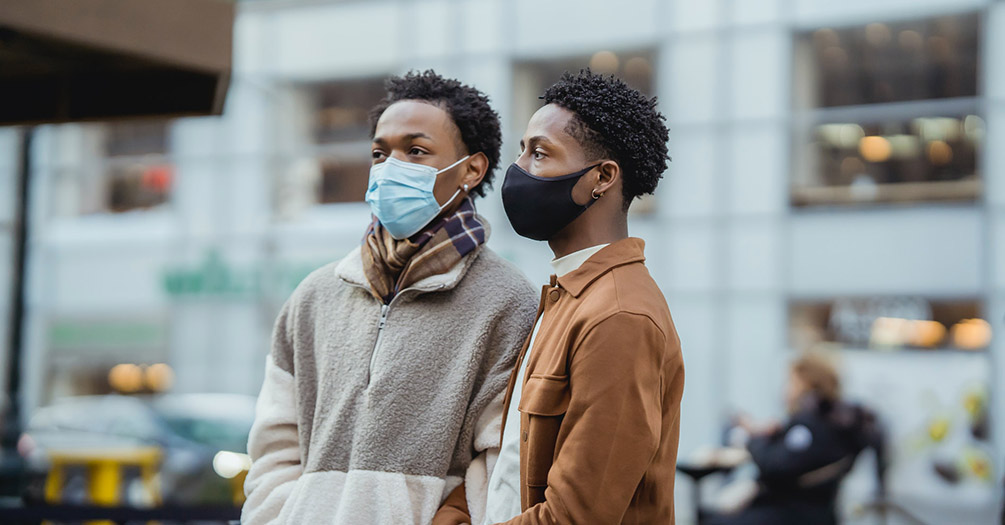 couple outside wearing masks