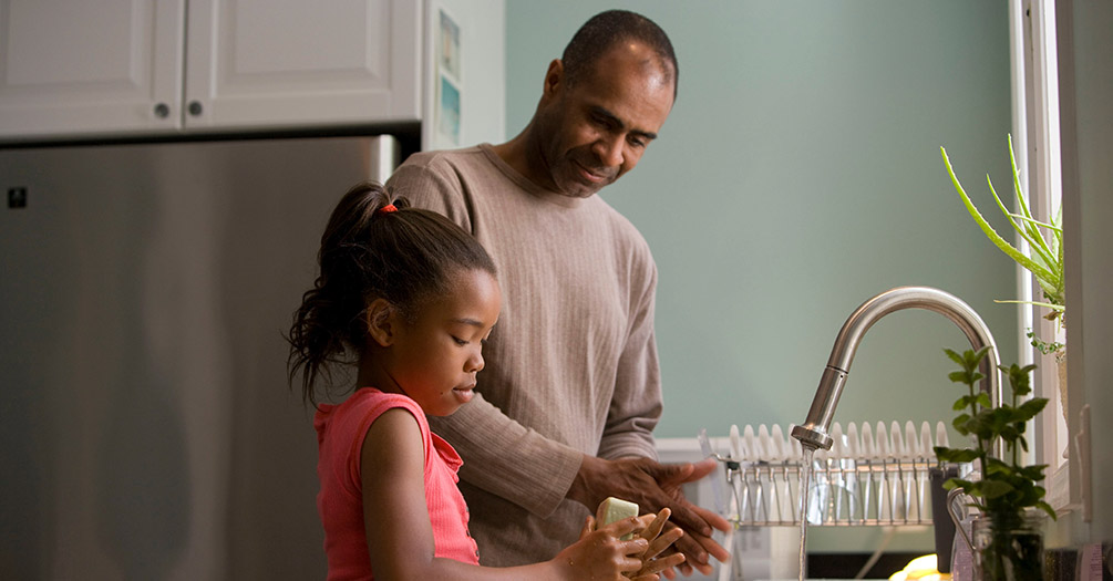 Parent and child talking in the kitchen