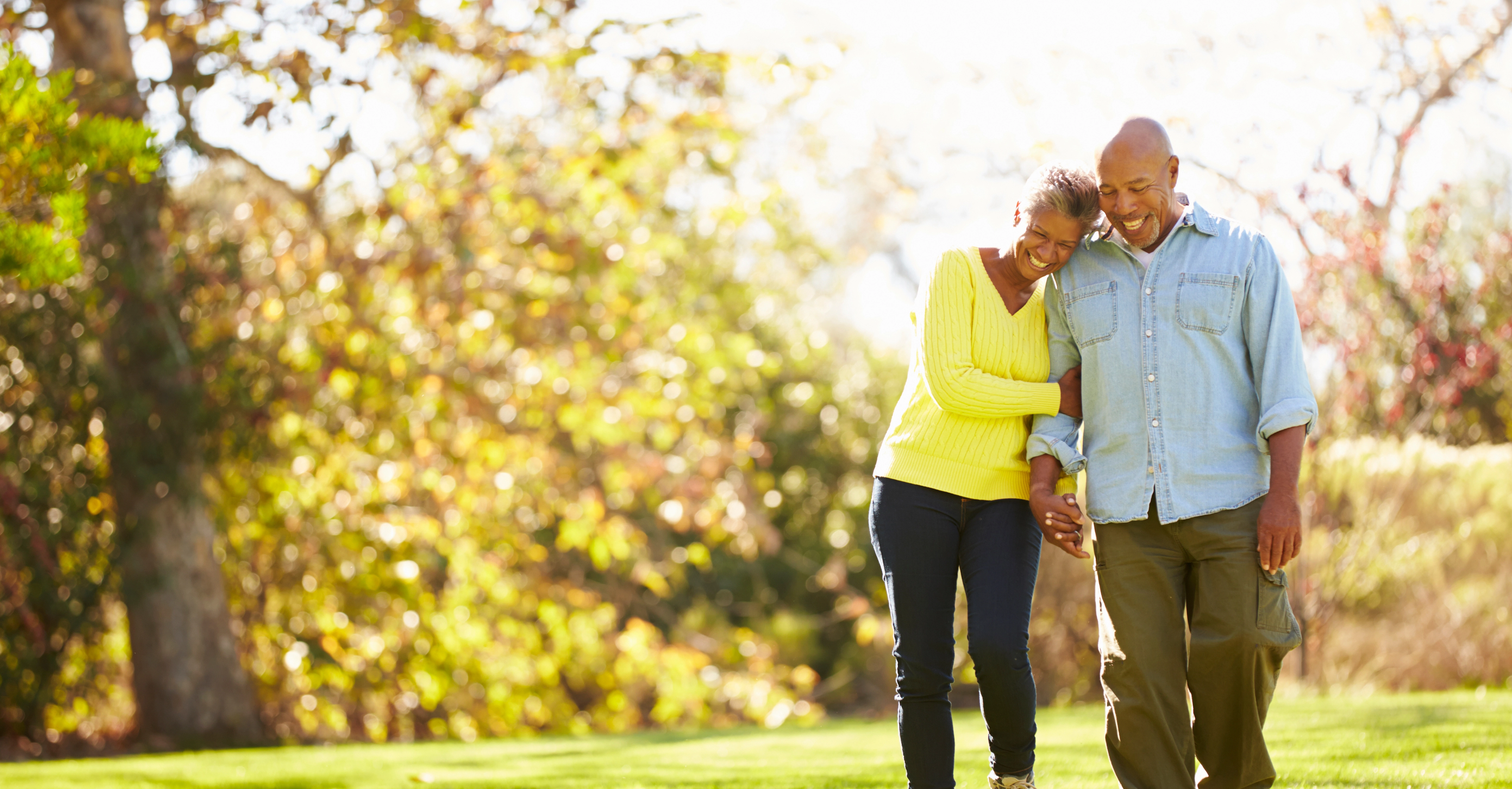 A middle aged couple going for walk.