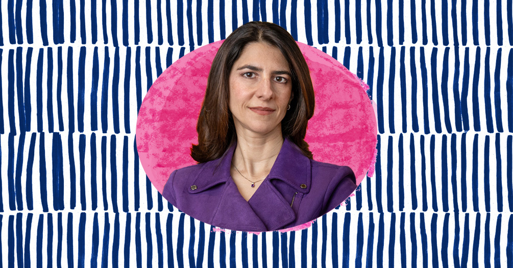 April Zeoli headshot, framed within an pink oval on a blue patterned background.