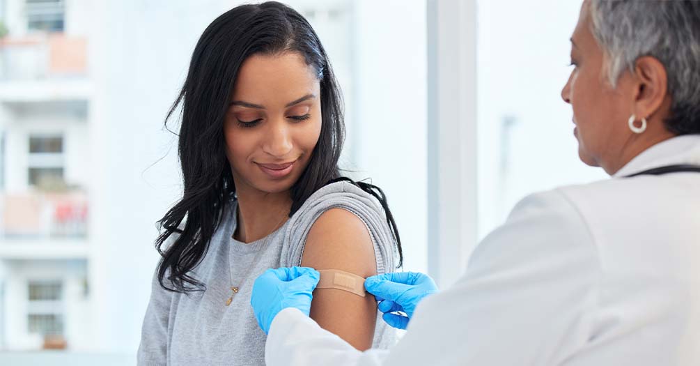 image of woman getting a vaccine